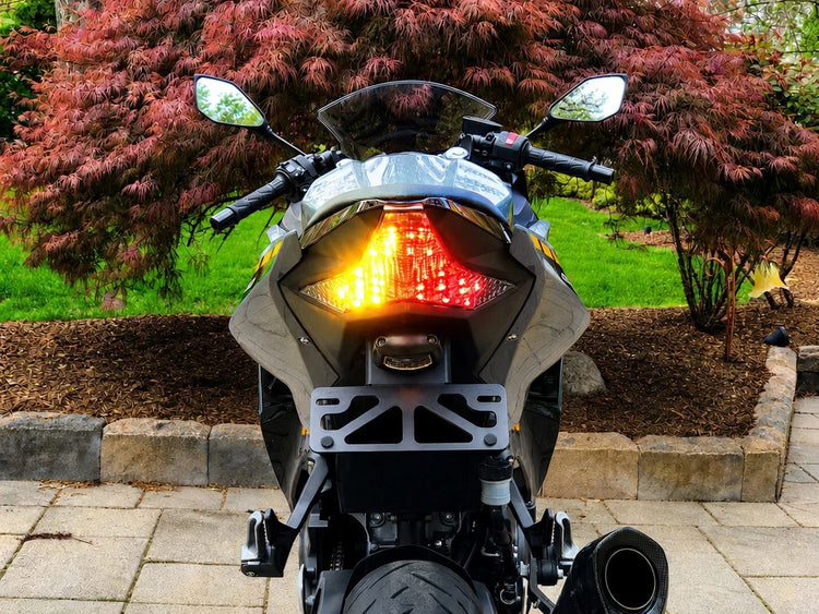 Rear of a sportbike fitted with a Custom LED Blaster-X integrated LED tail light, turn signals lit